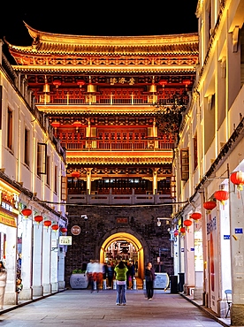 Guangji Gate Tower at night. Built in 1370, the gate leads into Chaozhou ancient city, Paifang street, Chaozhou City, Guangdong Province, China.