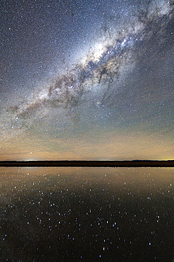 Starry night sky mirrored in a saline pool, Ojos del Mar, Tolar Grande, Argentina