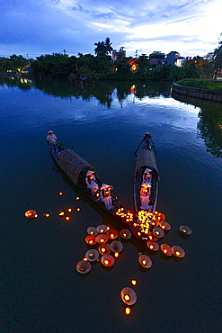Floating lanterns carrying candles as prayers, Nhu Y River, Hue, Central Vietnam. (MR)