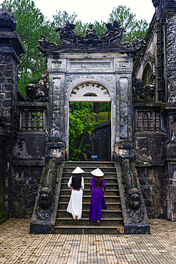 Elegant ladies on the steps of Khai Dinh Tomb, Hue, Central Vietnam. (MR)