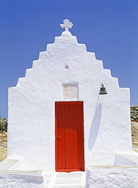 Close-up of red door in a whitewashed church on Mykonos, Cyclades, GreekIslands, Greece, Europe