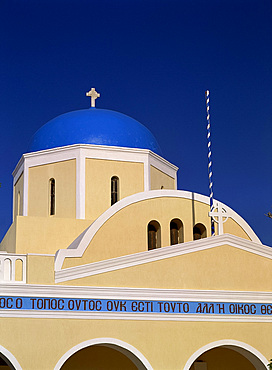 Church with inscription and blue dome, in the village of Oia, Santorini (Thira), Cyclades, Greek Islands, Greece, Europe