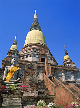 Statue of a seated Buddha below the temple of Wat Yai Chai Monghon at Ayutthaya, UNESCO World Heritage Site, Thailand, Southeast Asia, Asia