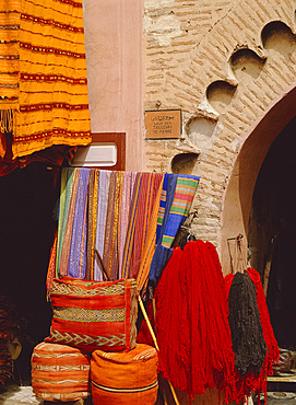 Carpets, cushions and wool for sale near the dyers' souk, Marrakech, Morocco