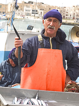 A fisherman on the island of Favignana in the Egadi Islands, off the coast of Sicily, Italy, Mediterranean, Europe