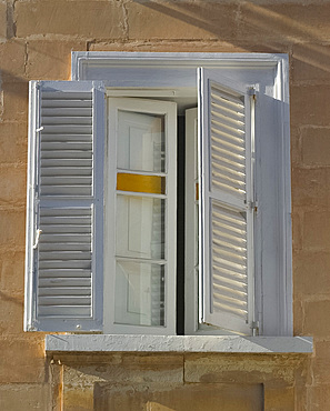 Old wooden shutters and stained glass window in St. Julian's, Malta, Mediterranean, Europe