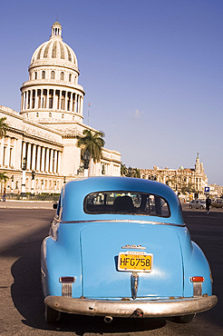 An old American car in front of the Capitolio in central Havana, Cuba, West Indies, Central America