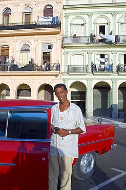 A Cuban man and his 1950's Chevy, Havana, Cuba, West Indies, Central America