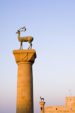 Stag and doe statues atop pillars at the entrance to Mandraki Harbour, Rhodes, Dodecanese Islands, Greek Islands, Greece, Europe