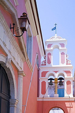 The pink and white belltower of Agios Triada in Gaios, Paxos, Ionian Islands, Greek Islands, Greece, Europe