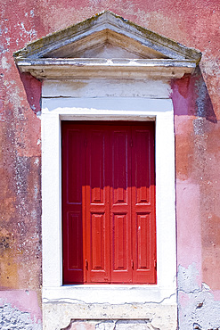 A classical red door in Gaios, Paxos, Ionian Islands, Greek Islands, Greece, Europe