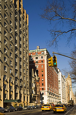 Taxis and highrise buildings along Central Park West in Manhattan, New York City, United States of America, North America