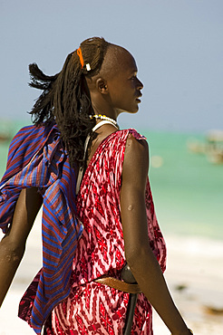 A Maasai tribesman on Paje Beach wearing colourful native dress, Paje, Zanzibar, Tanzania, East Africa, Africa