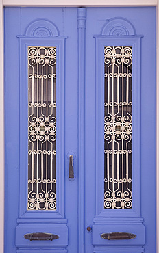 A traditional painted door with grille work in the village of Kritsa in eastern Crete, Greek Islands, Greece, Europe