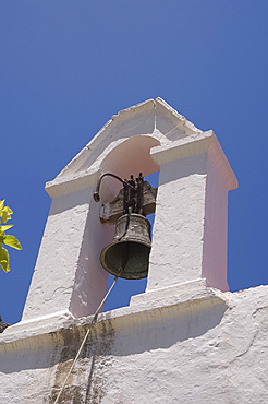 A white washed church bell tower in the village of Kritsa in eastern Crete, Greek Islands, Greece, Europe