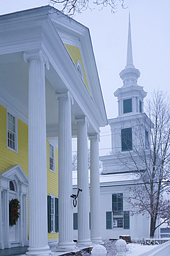 A traditional style white church with steeple during a snow storm, Rensselaerville, New York State, United States of America, North America