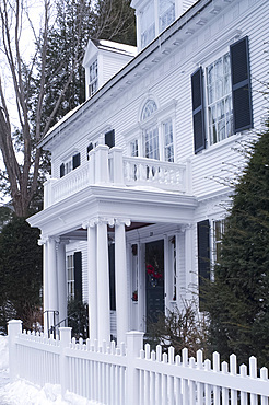 A traditional clapboard house with picket fence in Woodstock, Vermont, New England, United States of America, North America