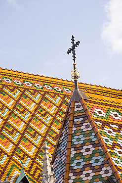 A detail of the colourful tiles on the roof of Matyas Church, Budapest, Hungary, Europe