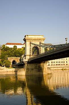 An early morning sail under the Chain Bridge on the Danube River, Budapest, Hungary, Europe