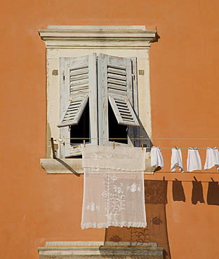 Laundry hanging from a shuttered window in Rovinj, Istria, Croatia, Europe