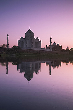 The Taj Mahal, UNESCO World Heritage Site, at sunset reflected in the Yamuna River, Agra, Uttar Pradesh, India, Asia