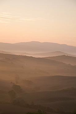 A dawn view over the misty hills of Val d'Orcia, UNESCO World Heritage Site, Tuscany, Italy, Europe