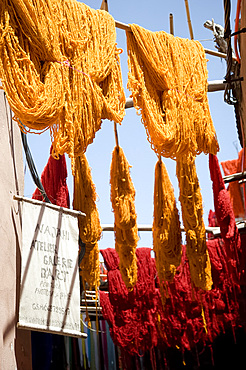 Brightly coloured wool hanging to dry in the dyers souk, Marrakech, Morocco, North Africa, Africa