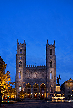 The Notre Dame Cathedral at dusk in the Place d'Arms, Montreal, Quebec Province, Canada, North America