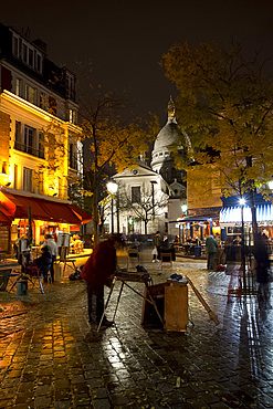 The Sacre Coeur and Montmartre on a rainy night, Paris, France, Europe