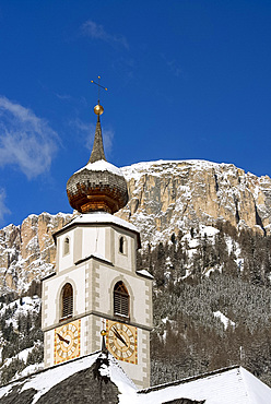 A church belltower in Colfosco in Badia in the Dolomites in the South Tyrol, Italy, Europe