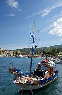 A traditional wooden fishing boat in the harbour in Kassiopi on the northeast coast of Corfu, Ionian Islands, Greek Islands, Greece, Europe