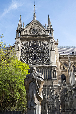 A statue of St. John Paul next to Notre-Dame Cathedral on the Ile de la Cite. Paris, France, Europe