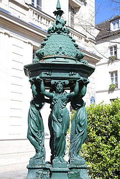 A green Wallace Fountain in the Place St.-Michel, Paris, France, Europe