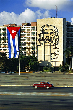 Cuban flag outside the Ministerio del Interior at Plaza de la Revolucion, Havana, Cuba, West Indies, Central America