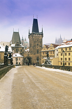 Charles Bridge and St. Vitus cathedral in winter snow, Prague, UNESCO World Heritage Site, Czech Republic, Europe