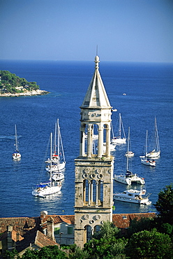 Church spire and boats in the harbour, Hvar Town, Hvar Island, Dalmatia, Dalmatian coast, Croatia, Europe