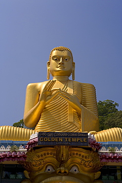 Giant gold seated Buddha statue at entrance to the Cave Temples, Golden Temple, Cave Temples, UNESCO World Heritage Site, Dambulla, Sri Lanka, Asia