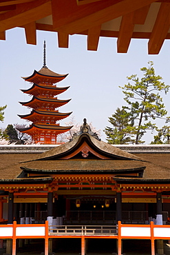 Itsukushima (Itsuku-shima) shrine built in 1168 by Taira-no-Kiyomori standing in the sea with the five-storied pagoda dating from 1407 behind, Miyajima, Hiroshima, Honshu, Japan, Asia