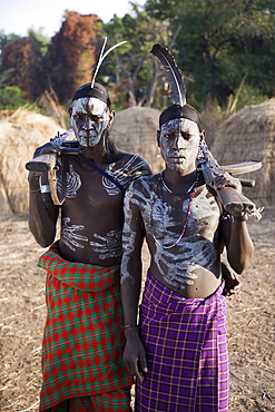 Mursi tribesmen with face and body decoration, Mursi Hills, Mago National Park, Lower Omo Valley, Ethiopia, Africa