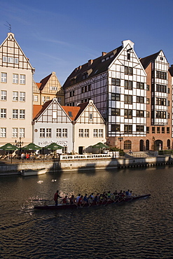 Restored warehouses along the Stara Motlawa River (Mottla River), Gdansk, Pomerania, Poland, Europe