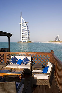 The iconic symbol of Dubai, the Burj Al Arab, the world's first seven star hotel (classified as five star deluxe), built on an artificial island offshore from the Jumeirah Beach Hotel, Dubai, United Arab Emirates, Middle East