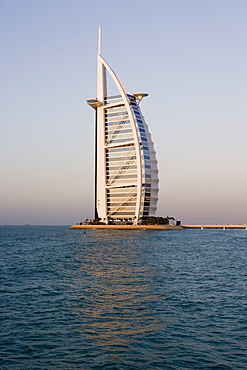 The iconic symbol of Dubai, the Burj Al Arab, the world's first seven star hotel (classified as five star deluxe), built on an artificial island offshore from the Jumeirah Beach Hotel, Dubai, United Arab Emirates, Middle East