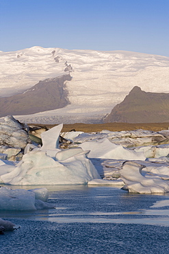 Icebergs floating in the Lagoon beneath Breidamerkurjokull Glacier, Jokulsarlon (Glacial River Lagoon), southern Vatnajokull, southern area, Iceland, Polar Regions