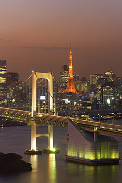 Elevated view of Rainbow Bridge and Tokyo Tower illuminated at dusk, Odaiba, Tokyo Bay, Tokyo, Honshu, Japan, Asia