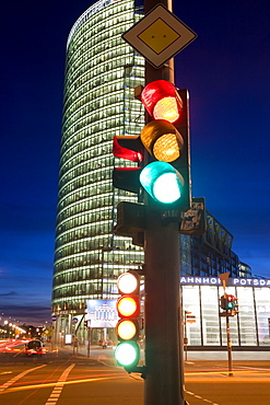 Traffic signal and office buildings illuminated at dusk in new urban development, Potsdamer Platz, Berlin, Germany, Europe