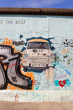 View from former East Berlin of section of Berlin Wall, called East Side Gallery because it has been painted by many international artists, Berlin, Germany, Europe