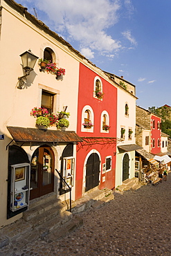 Cobbled street lined with colourful houses known as Kujundziluk, one of the oldest streets in Mostar leading to the Old Bridge, Old Town, UNESCO World Heritage Site, Mostar, Herzegovina, Bosnia Herzegovina, Europe