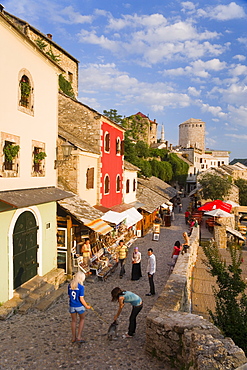 Cobbled street lined with colourful houses known as Kujundziluk, one of the oldest streets in Mostar leading to the Old Bridge, Old Town, UNESCO World Heritage Site, Mostar, Herzegovina, Bosnia Herzegovina, Europe