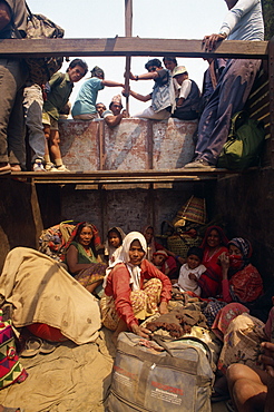 People's local transport is the back of trucks, Nepal, Asia