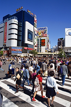 People on road crossing in Shibuya-Ku area, Tokyo, Japan, Asia